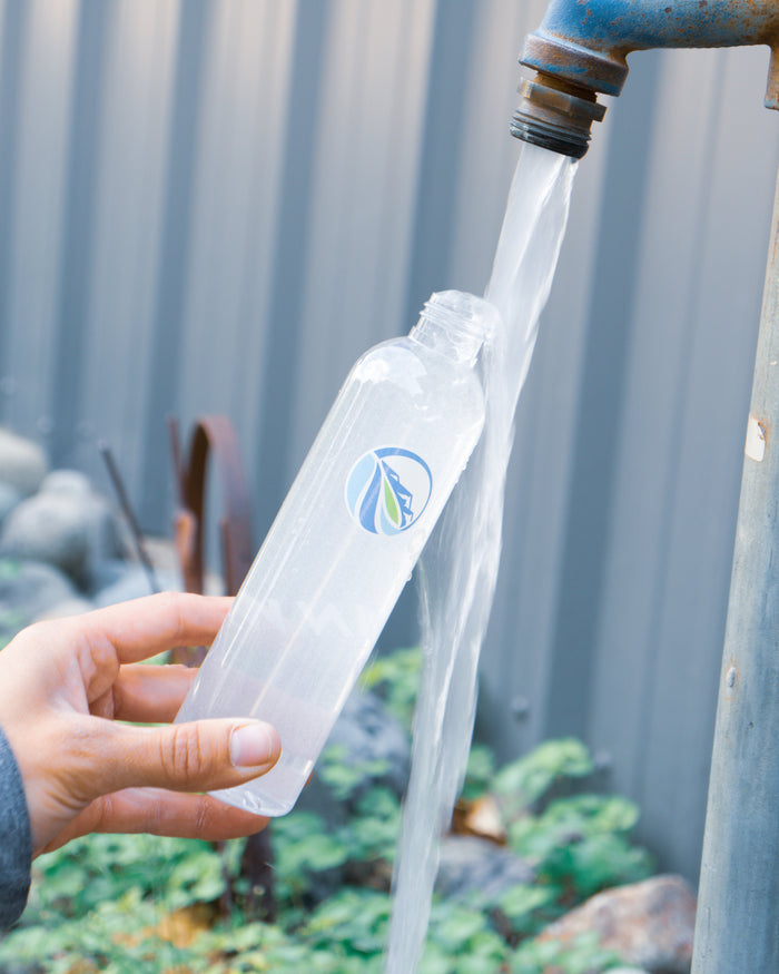 Amy filling a water test bottle